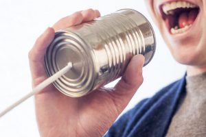 a tin can telephone with a string